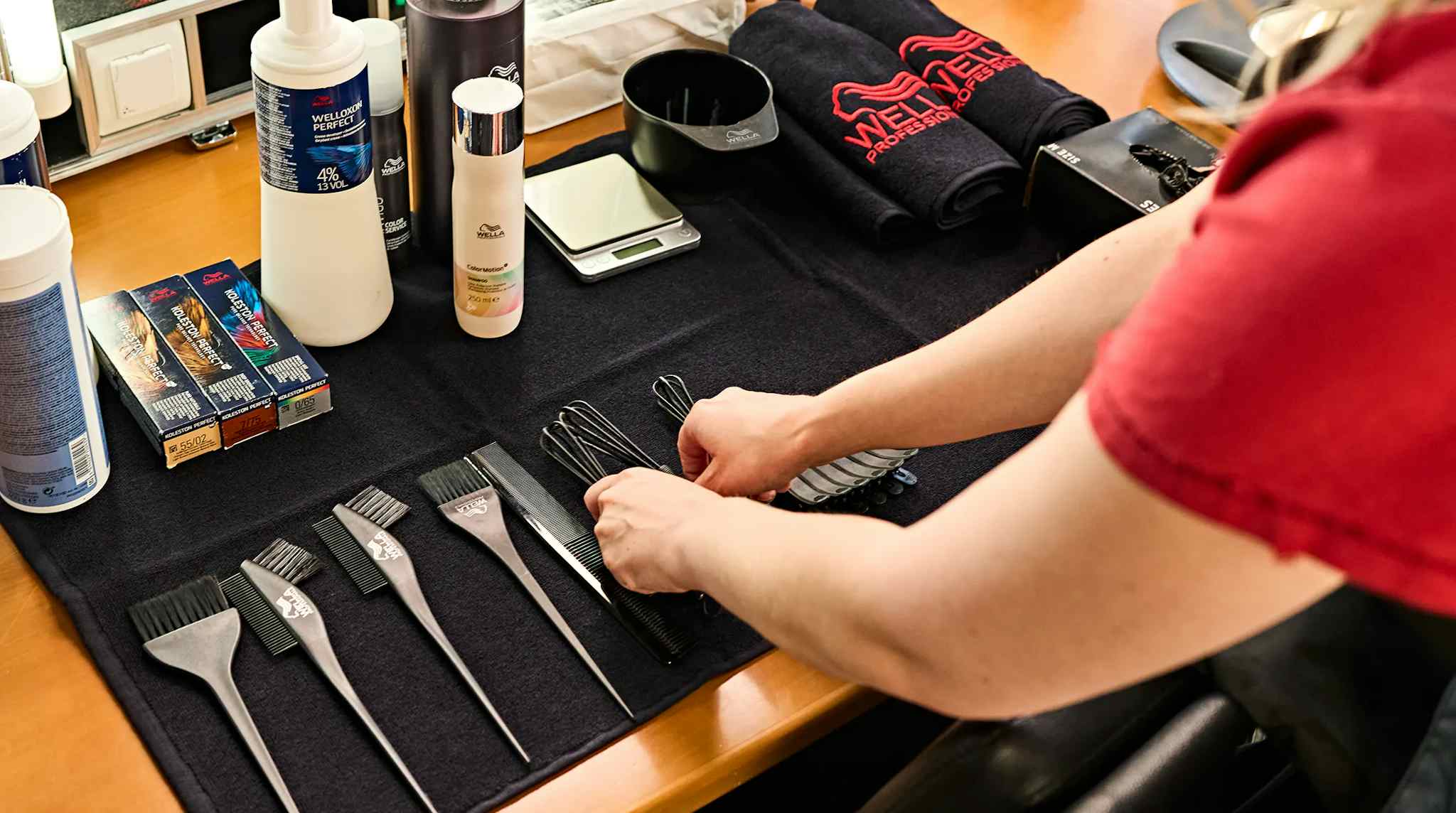 Table filled with high quality hairdressing accessories of Wella Professionals